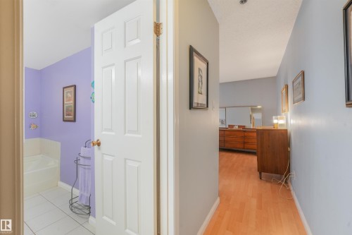Hard-surface flooring, white interior doors, and recessed ceiling lighting - #203 10171 119 St Nw, Edmonton, AB 