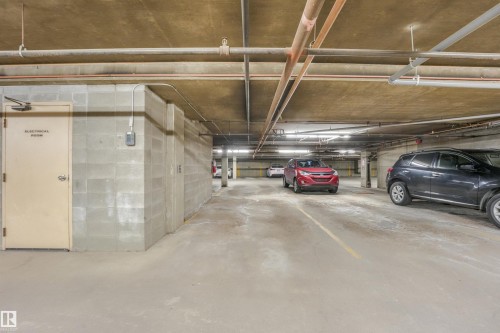 Underground parking garage with concrete walls and ceiling - #203 10171 119 St Nw, Edmonton, AB 