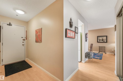 Wood-finish flooring throughout, smooth ceilings, and recessed lighting - #203 10171 119 St Nw, Edmonton, AB 
