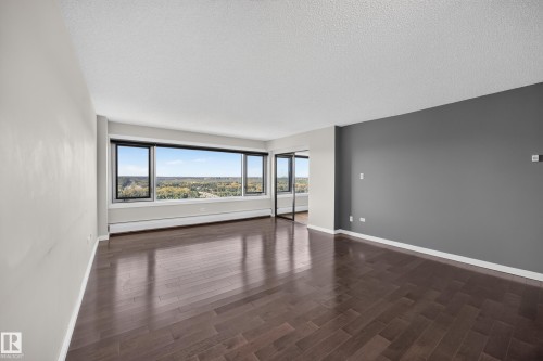 Large Living Room/Dining Room space with stunning south facing views of the River Valley and Victoria Golf Course. - #803 10011 123 St Nw, Edmonton, AB 