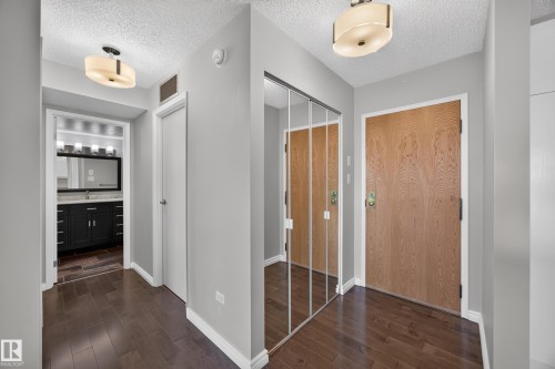 Entry way into the Condo featuring full length mirrored closet. - #803 10011 123 St Nw, Edmonton, AB 