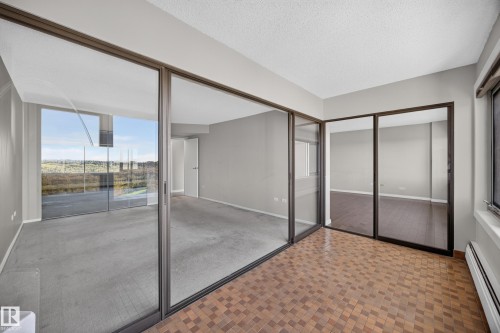 Flex space separated from the Living Room and Bedroom by glass sliding doors. Home office, library, or simply a stunning place to unwind. - #803 10011 123 St Nw, Edmonton, AB 