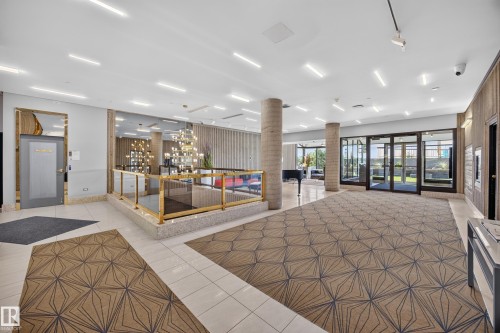 Lobby of the Condo Building featuring seating area, grand piano, mailboxes, and on site manager office. - #803 10011 123 St Nw, Edmonton, AB 