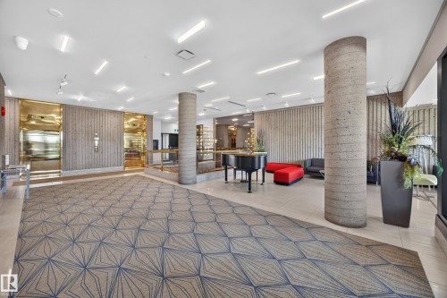 Lobby of the Condo Building featuring seating area, grand piano, mailboxes, and on site manager office. - #803 10011 123 St Nw, Edmonton, AB 