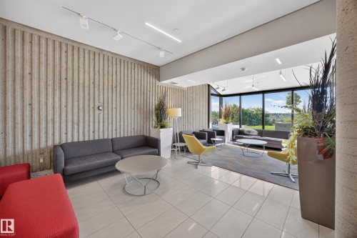 Lobby of the Condo Building featuring seating area, grand piano, mailboxes, and on site manager office. - #803 10011 123 St Nw, Edmonton, AB 