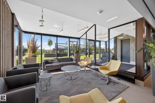 Lobby of the Condo Building featuring seating area, grand piano, mailboxes, and on site manager office. - #803 10011 123 St Nw, Edmonton, AB 