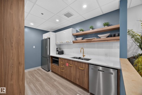 Condo Building Social Room Space featuring Kitchen, Dining Room Space, Multiple Lounge Spaces, two Bathrooms, and access to outdoor common space. - #803 10011 123 St Nw, Edmonton, AB 