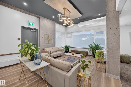 Condo Building Social Room Space featuring Kitchen, Dining Room Space, Multiple Lounge Spaces, two Bathrooms, and access to outdoor common space. - #803 10011 123 St Nw, Edmonton, AB 