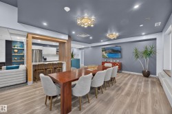 Condo Building Social Room Space featuring Kitchen, Dining Room Space, Multiple Lounge Spaces, two Bathrooms, and access to outdoor common space. - 