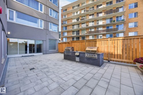 Condo Building Outdoor Common Space featuring Resident BBQ Area, Gazebo, Sitting Areas, Beautiful Landscaping, and Stunning River Valley views. - #803 10011 123 St Nw, Edmonton, AB 