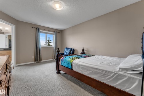 Carpeted flooring, neutral wall tones, recessed window, and flush mount lighting - 1226 Mcallister Way Sw, Edmonton, AB 