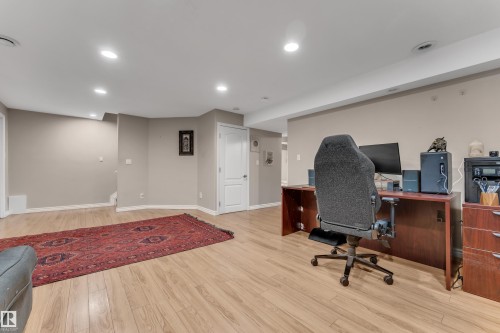 Recessed ceiling lighting, wood-finish flooring, light-toned wall paint, and white paneled doors - 1226 Mcallister Way Sw, Edmonton, AB 