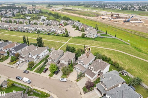 Residential neighborhood with established homes, green spaces, and a paved pathway system - 1226 Mcallister Way Sw, Edmonton, AB 