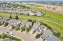Residential neighborhood with established homes, green spaces, and a paved pathway system - 1226 Mcallister Way Sw, Edmonton, AB 