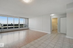 Expansive windows, wood-finish flooring, tiled flooring, built-in bi-fold closet, and a surface-mounted ceiling light fixture - 
