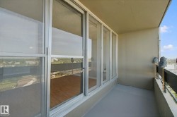 Balcony featuring a painted concrete floor and a metal railing - 