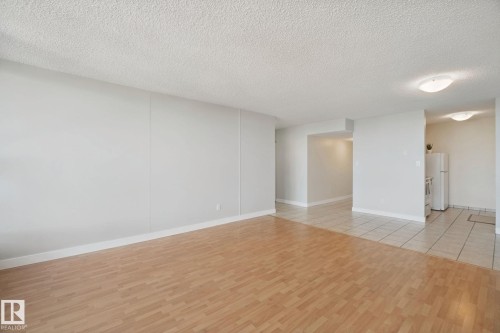 Wood-finish flooring with a tiled entryway - #104 8745 165 St Nw, Edmonton, AB 