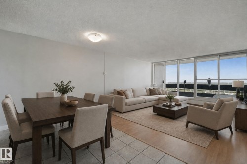 Open-concept living area with tile and wood-finish flooring - #104 8745 165 St Nw, Edmonton, AB 