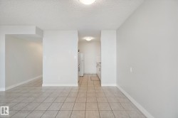 Tile flooring throughout the main living space and kitchen - 