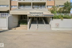 Building entrance with a covered awning and prominent signage - 