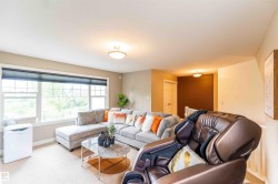 Spacious room with large windows, neutral wall tones, and ceiling-mounted lighting fixtures - 