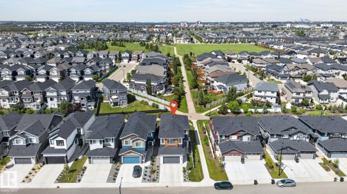 Modern residential development featuring single-family homes with attached garages, paved driveways, and landscaped front yards - 16304 19 Avenue Sw, Edmonton, AB 