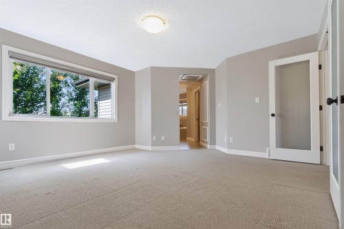 Recessed lighting and a large window - 1420 158 Street Sw, Edmonton, AB 