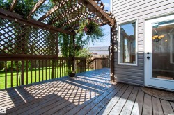 Wood-finish deck with a lattice pergola - 