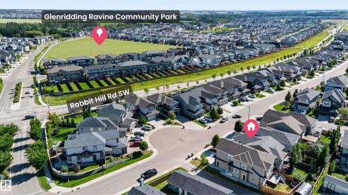 Aerial perspective of a residential neighborhood featuring detached homes and a community park - 1420 158 Street Sw, Edmonton, AB 