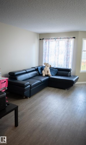 Wood-finish flooring throughout the space - 9014 Cooper Link Link Sw, Edmonton, AB 