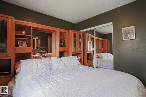 Built-in wood cabinetry with open shelving and closed storage - 11440 144 Avenue Nw, Edmonton, AB 