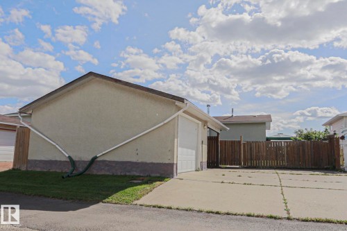 Attached garage with white panel door - 11440 144 Avenue Nw, Edmonton, AB 