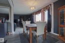 Wood-finish flooring throughout the dining area and adjacent space - 11440 144 Avenue Nw, Edmonton, AB 