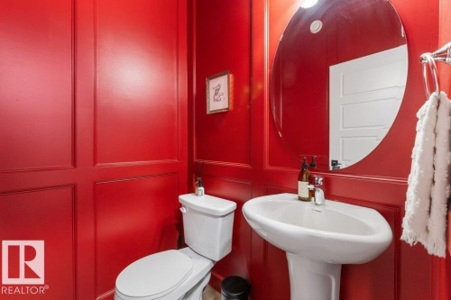 Red paneled walls with decorative trim - 34 Raspberry Road, St. Albert, AB 