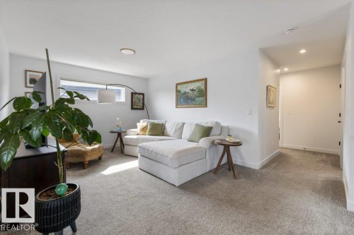 Recessed lighting, carpet flooring, a horizontal window, and white walls - 34 Raspberry Road, St. Albert, AB 