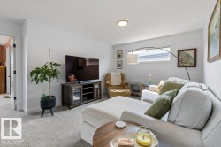 Recessed ceiling lighting, white interior walls, and gray carpeted flooring - 