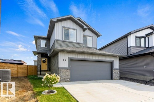 Contemporary exterior with mixed siding and stone accents - 34 Raspberry Road, St. Albert, AB 