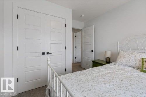 White paneled doors with black hardware - 34 Raspberry Road, St. Albert, AB 