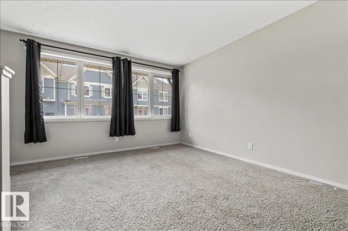 Carpeted room with light gray walls - #31 603 Watt Bv Sw, Edmonton, AB - Indoor Photo Showing Other Room