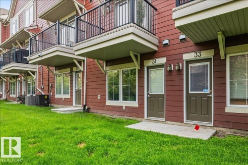 Red siding exterior with white trim - #31 603 Watt Bv Sw, Edmonton, AB - Outdoor With Balcony
