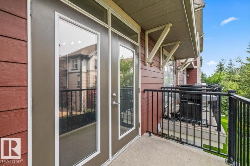 Private balcony with concrete flooring and black metal railings - #31 603 Watt Bv Sw, Edmonton, AB - Outdoor With Balcony With Exterior