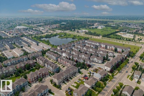 Aerial perspective showcasing a residential community with varied architectural styles - #31 603 Watt Bv Sw, Edmonton, AB - Outdoor With View