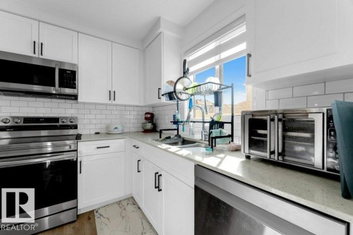1183 Aster Boulevard Nw, Edmonton, AB - Indoor Photo Showing Kitchen With Double Sink With Upgraded Kitchen