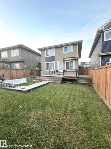 Two-story exterior with light brown siding and white trim - 20827 130 Avenue Nw, Edmonton, AB 