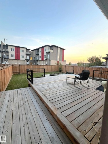 Expansive wood deck with multi-level design and perimeter railings - 20827 130 Avenue Nw, Edmonton, AB 