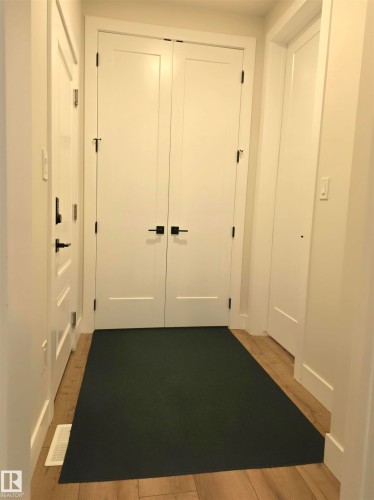 Neutral-toned walls complement the wood-finish flooring - 20827 130 Avenue Nw, Edmonton, AB 