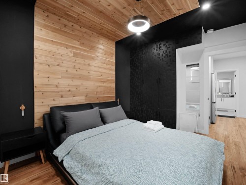 Wood-finish plank flooring and ceiling - 20827 130 Avenue Nw, Edmonton, AB 