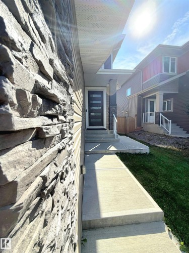 Stone veneer exterior detailing - 20827 130 Avenue Nw, Edmonton, AB 