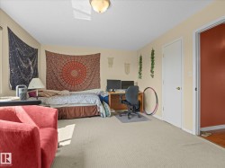 Spacious room featuring neutral carpeting and light-colored walls - 