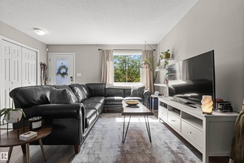 Recessed lighting, wood-finish flooring, white paneled doors, and built-in shelving units - 4306 Prowse Link Link Sw, Edmonton, AB 